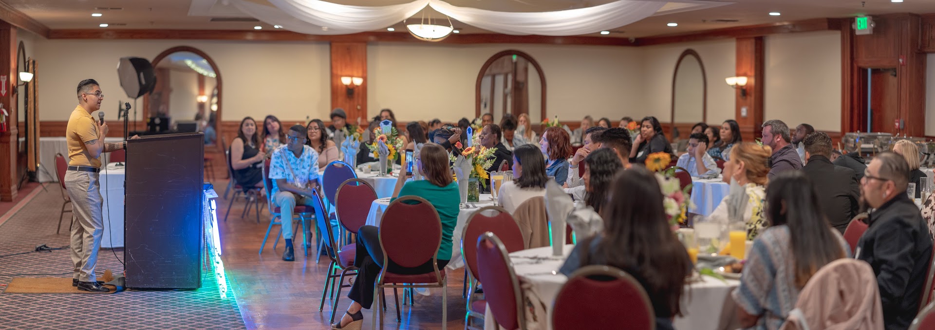L. Patty Flores speaking at a university event